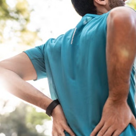 sportsman feeling backache at a park royalty free image 1684741404